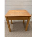 A children's pine desk (H61cm W60cm D46cm)