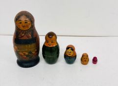 A wooden nesting doll set consisting of five pieces