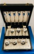 A boxed set of silver plated forks and spoons