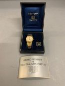 A Vintage Seiko Day Date Quartz watch in box.