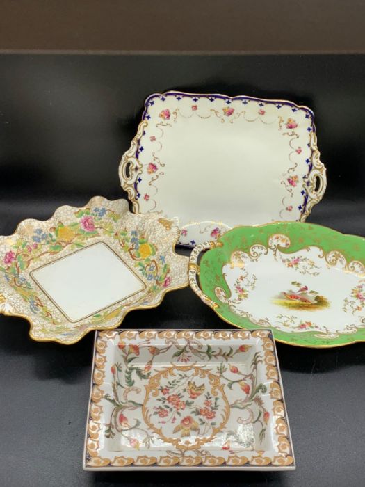 Four china decorative handed plates and side dishes