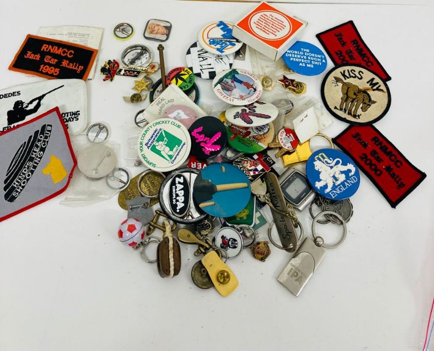 A selection of various badges and keyrings