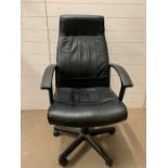 A faux leather office chair