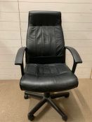 A faux leather office chair
