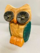 A carved wooden owl