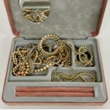 A box of costume jewellery to include pearl bracelets, necklaces and earrings
