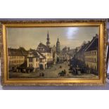 A print on canvas of a town square in a gilded frame (59cm x 104cm).