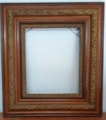 An English frame parcel gilt with floral decorations (72x64.5 cm total/ 41.4x34.5 cm interior)