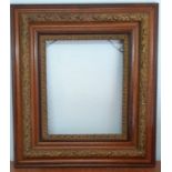 An English frame parcel gilt with floral decorations (72x64.5 cm total/ 41.4x34.5 cm interior)