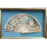 A Victorian hand painted and mother of pearl fan with a scene galante and floral gilt decorated