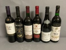 Six assorted bottles of red wine (See photos for labels)