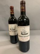 A Bottle of 2000 Chateau Beychelle along with a bottle of 2008.