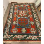 An Aztec design rug (310cm x 220cm)