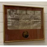 A King Charles I charter with part of a seal.