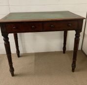 A mahogany writing table with leather top on turned legs (H7cm W91cm D52cm)