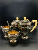 A silver tea service comprising tea pot, hot water pot, sugar bowl and milk jug by Robert Edgar