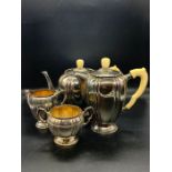 A silver tea service comprising tea pot, hot water pot, sugar bowl and milk jug by Robert Edgar