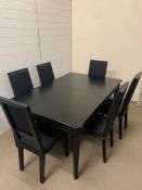 A Laura Ashley Henshaw black 6-8 seater extending dining table and six chairs (H75cm W114cm D173cm)