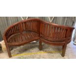 A wooden garden love or conversation seat