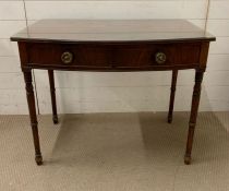 A mahogany side desk with drawers and turned legs and glass top (Cracked) (H76cm W94cm D54cm)