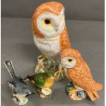 A selection of four Beswick figures to include two owls