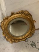 A Round gilt frame mirror with scroll detail