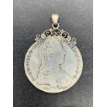 A Maria Theresa thaler, silver bullion on a pendant mount.