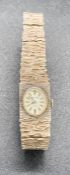 An Accurist silver, marked 925 bark effect ladies watch