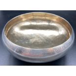 A silver bowl on a single foot, engraved to rim, (Total weight 280g) Hallmarked for London 1986 by