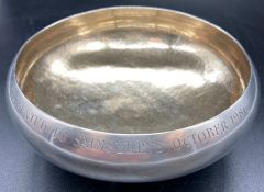 A silver bowl on a single foot, engraved to rim, (Total weight 280g) Hallmarked for London 1986 by