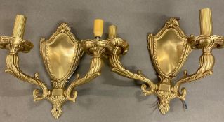 A pair of brass light wall sconces