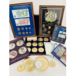 A selection of collectable coins, medallions, coin sets and framed sets.