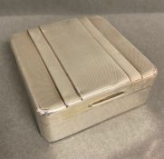 A Silver cigarette box, hallmarked for Birmingham by Adie Brothers Ltd 1949.