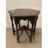 An oak occasional table, octagonal top on turned legs (H66cm W57cm)