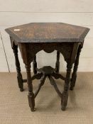 An oak occasional table, octagonal top on turned legs (H66cm W57cm)