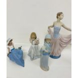 A selection of four Lladro and Lladro Nao porcelain figurines some boxed
