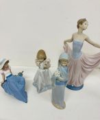 A selection of four Lladro and Lladro Nao porcelain figurines some boxed