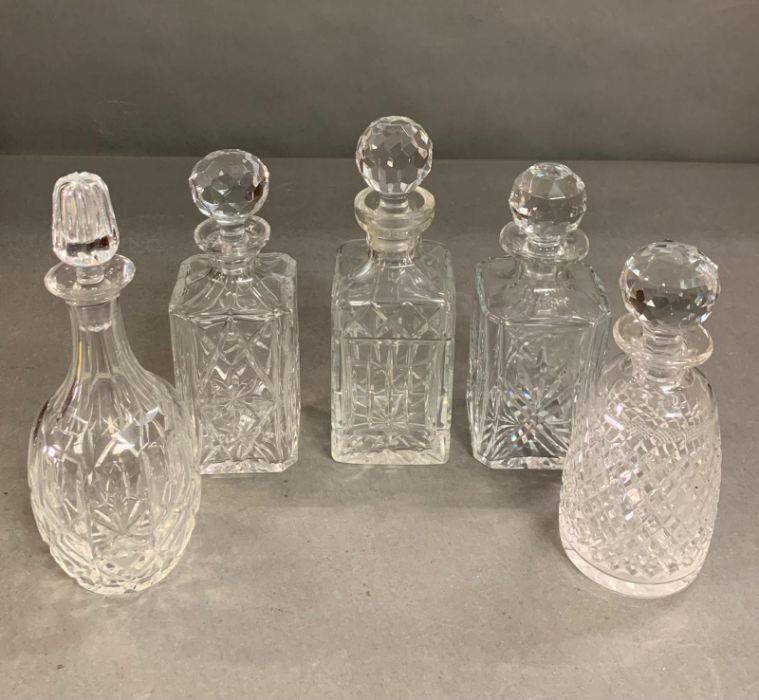 A selection of five crystal cut glass decanters