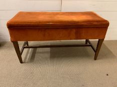 An upholstered stool, possibly an organ stool (W93 cm x D 40 cm x H 49 cm)