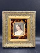 A miniature portrait of a lady in a torsise shell surround gilt wood frame (Image 7cm x 6cm)