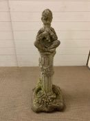 Garden stone figure of a boy playing flutes, seated. H 90 cm