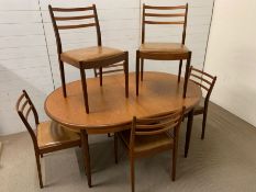 A G Plan table with six chairs (213cm x 110 cm x 75 cm)