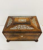 A work box decorated with inlaid mother of pearl.