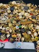 A Large volume of military cap badges, buttons and insignia