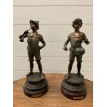 Two metal figures playing musical instruments (H42cm)