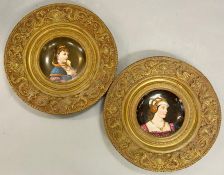 Two metal charges with painted portraits plates centre