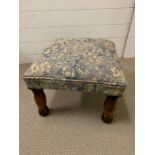 A square upholstered stool on mahogany legs (47cm sq x 34 cm H)