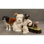 A selection of four Beswick figures to include two dogs, a cat and 'Watch It'