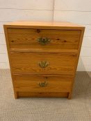 A three drawer pine side cabinet