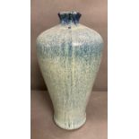 A Studio pottery vase with blue/green glaze H 41 cm